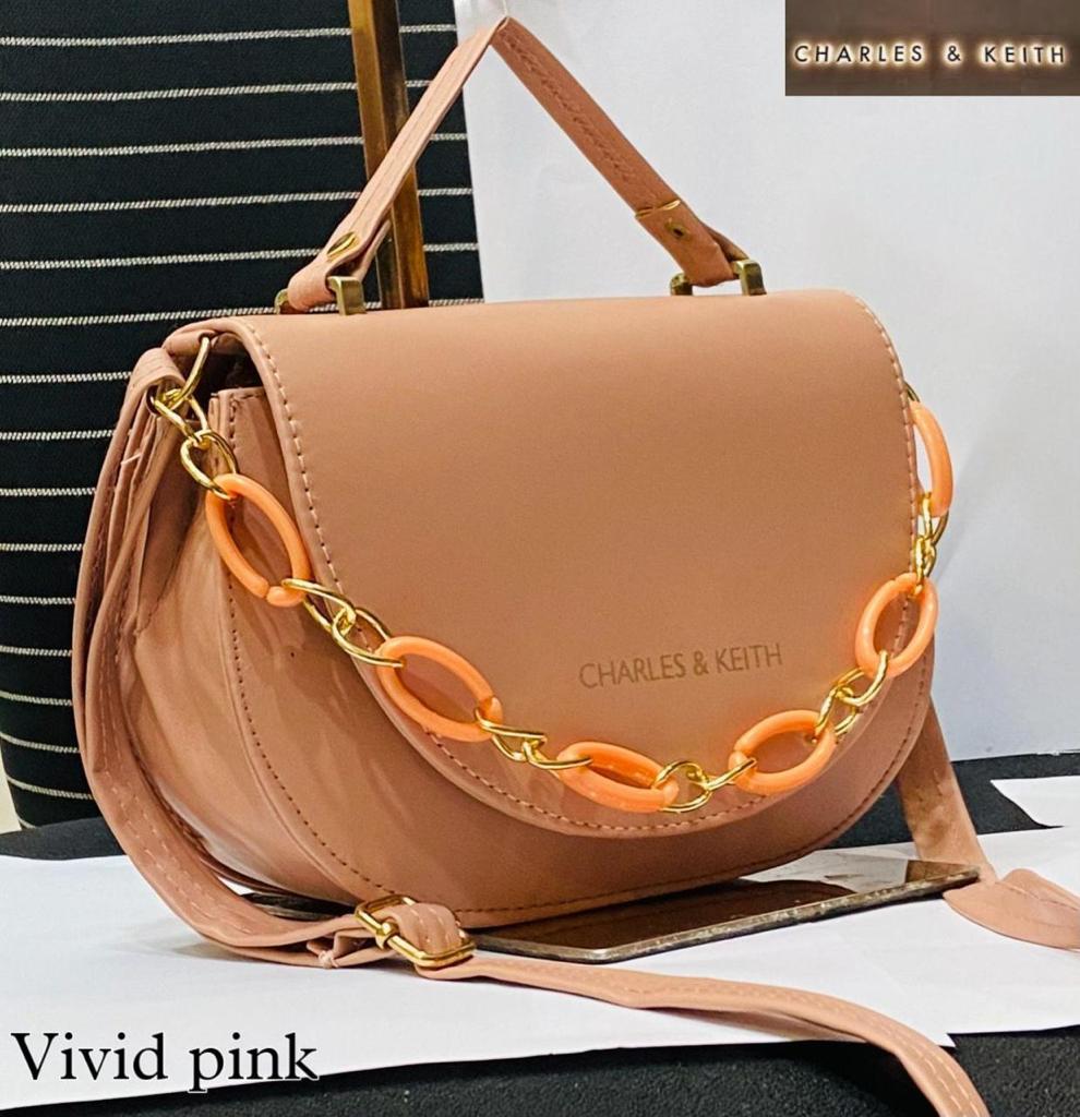Circular Elegance: Round Shape Sling Bag with Plastic Design Chain